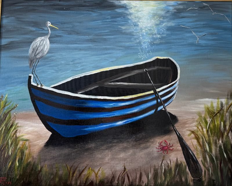 Blue rowboat on a shore at dusk with a white egret on its bow and an oar in the sand