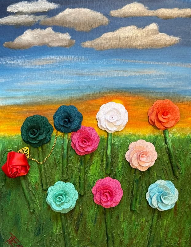 Field of raised fabric roses in many colors under a sunset sky with clouds